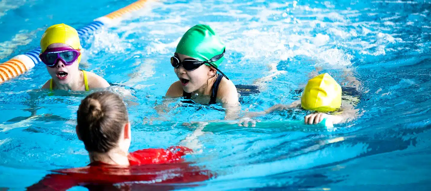 swimming in pool during lesson